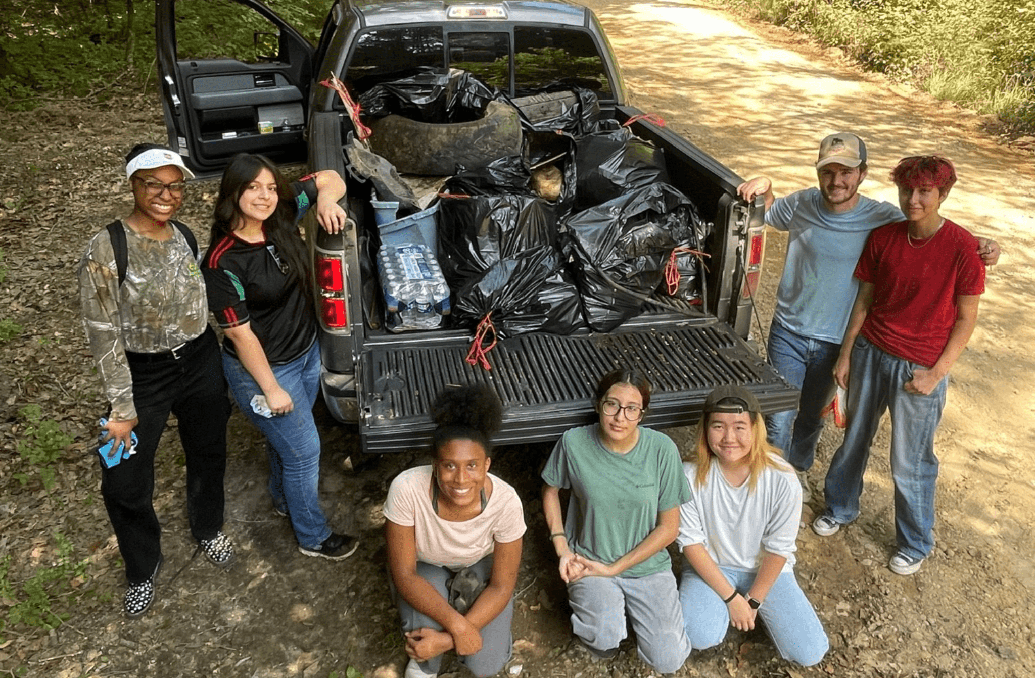 Volunteers cleaning illegal dumping sites at Cahaba River WMA
