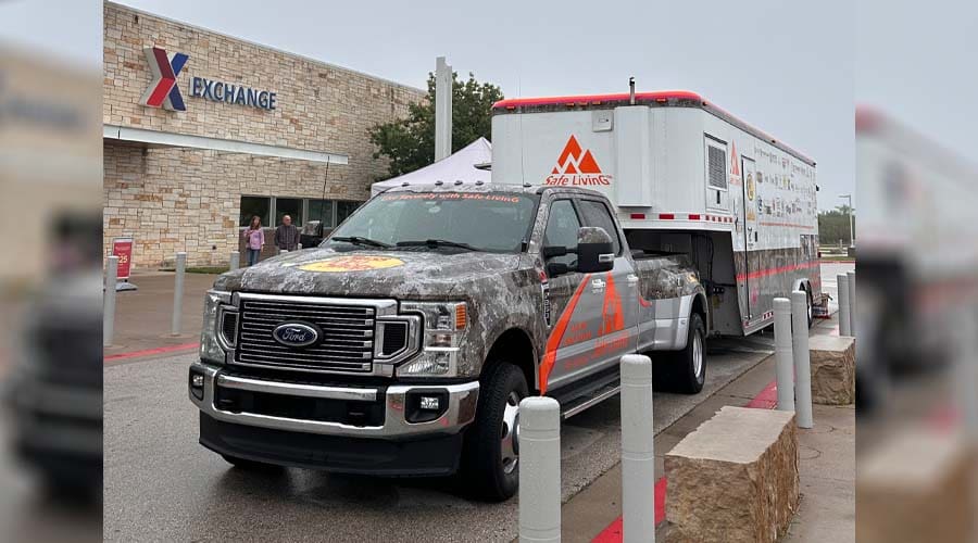 Safe LivinG event booth at Fort Meade Exchange with interactive firearm safety displays