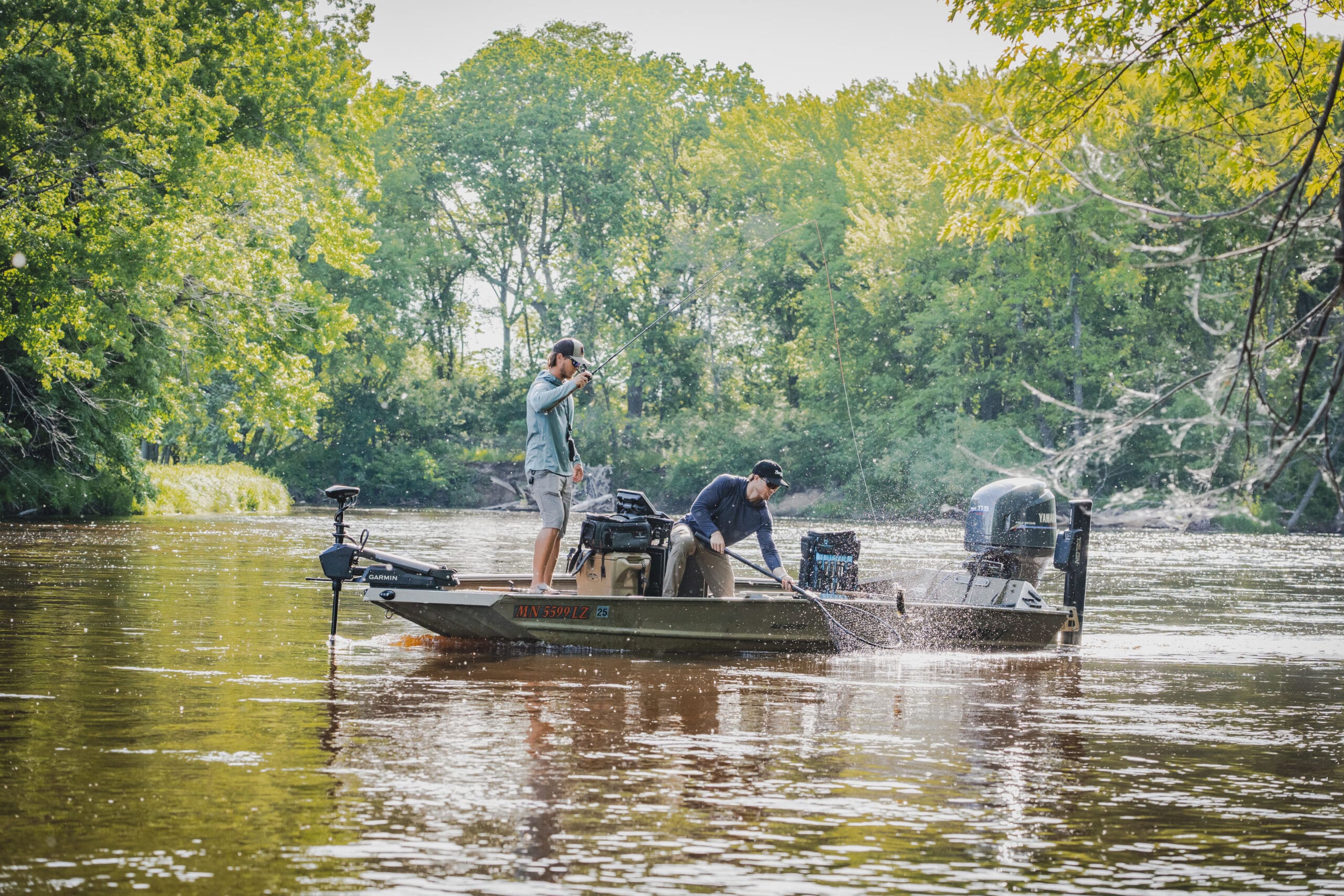 two men fishing in a boat