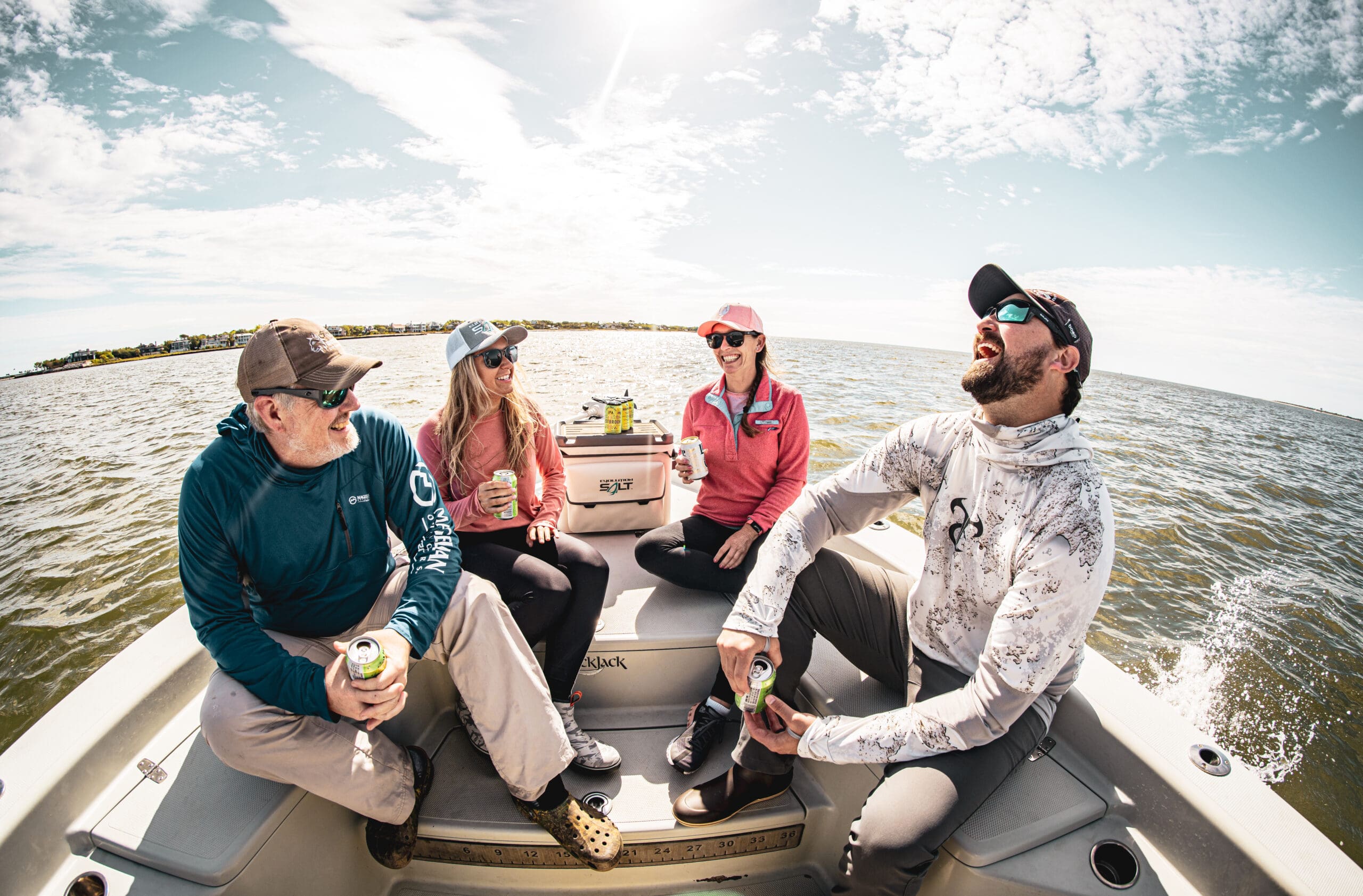person on a boat with fishing pole