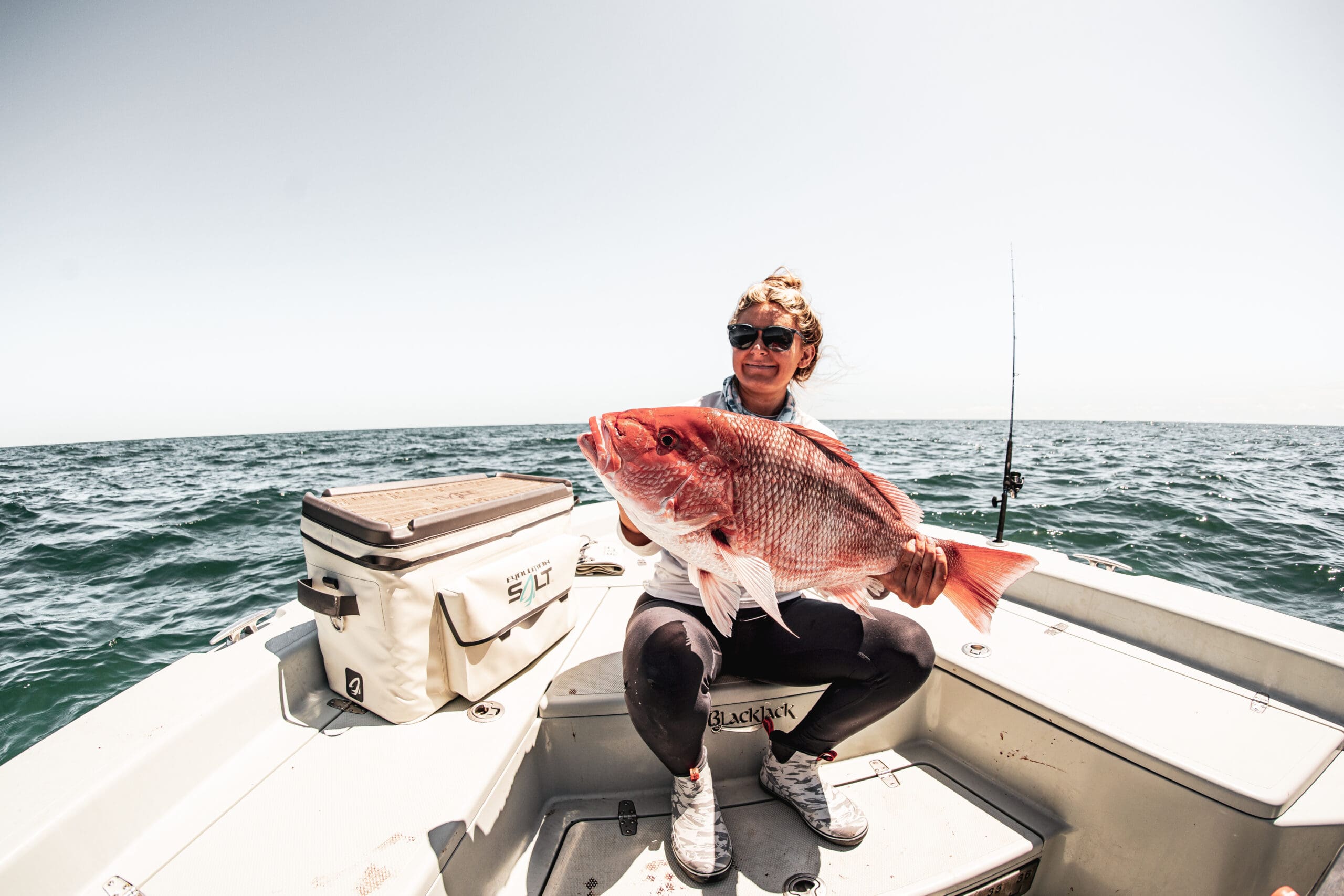 person in canoe fishing