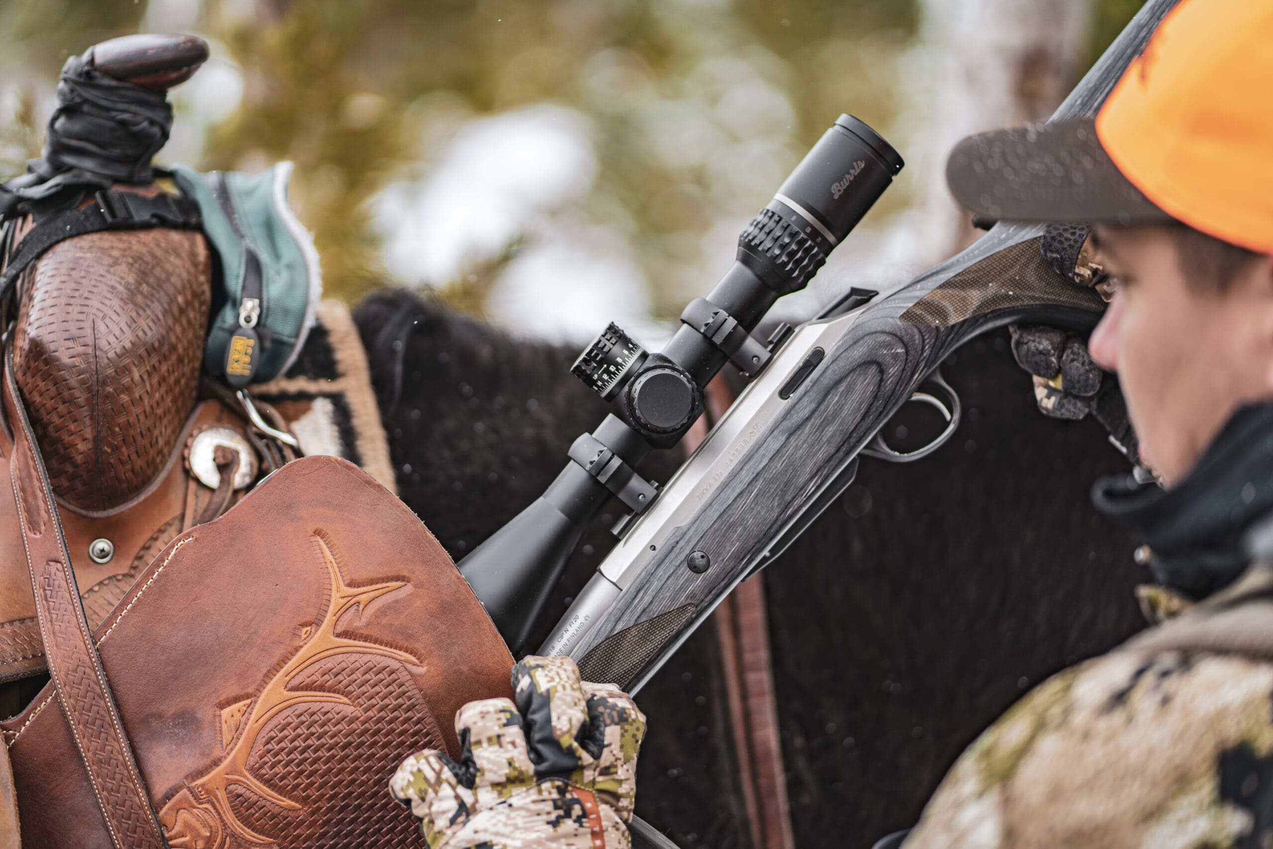 Two hunters exchanging Remington ammo pack during tactical marketing photoshoot.